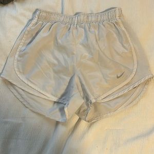 White Nike running shorts